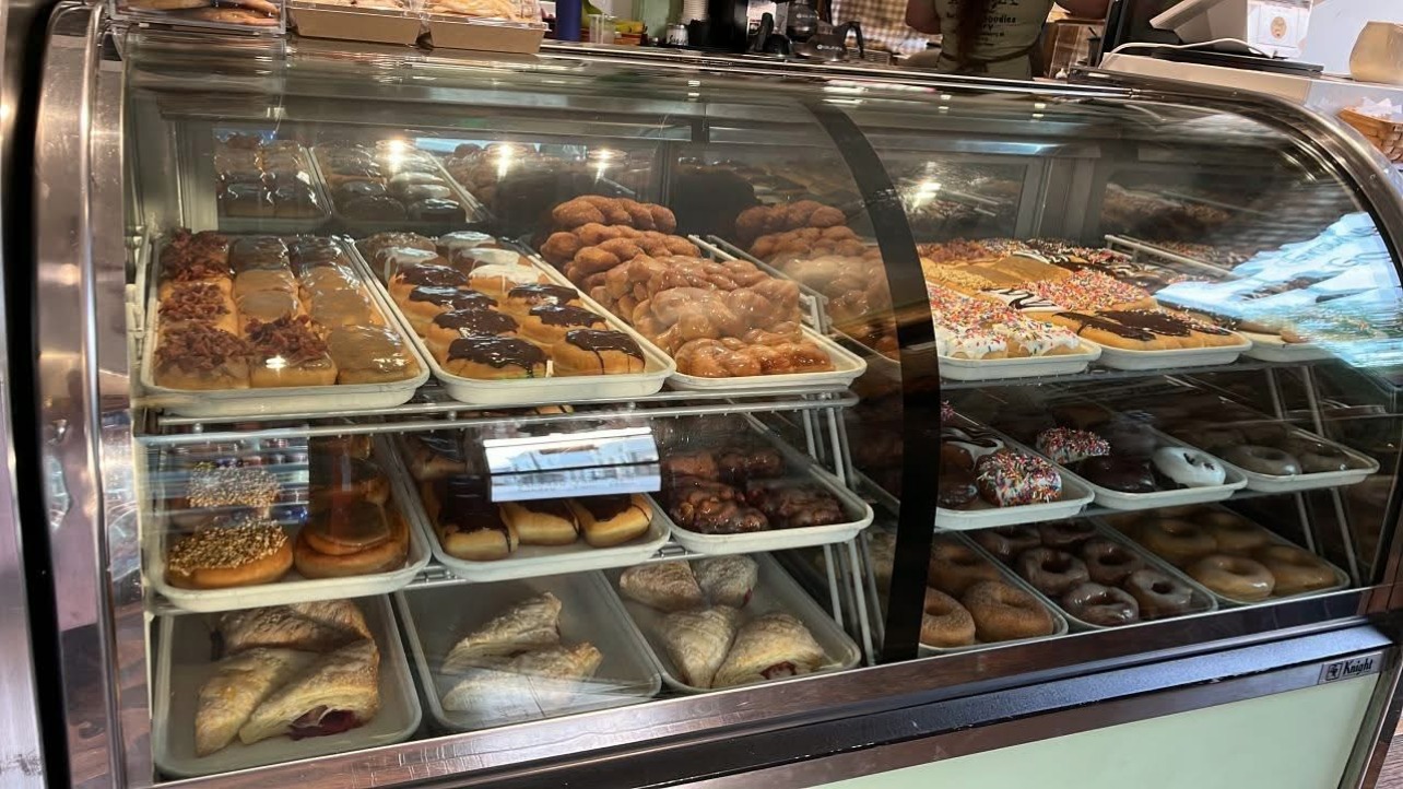 Bakery case at Granny's Goodies filled with fresh donuts, fritters and turnovers